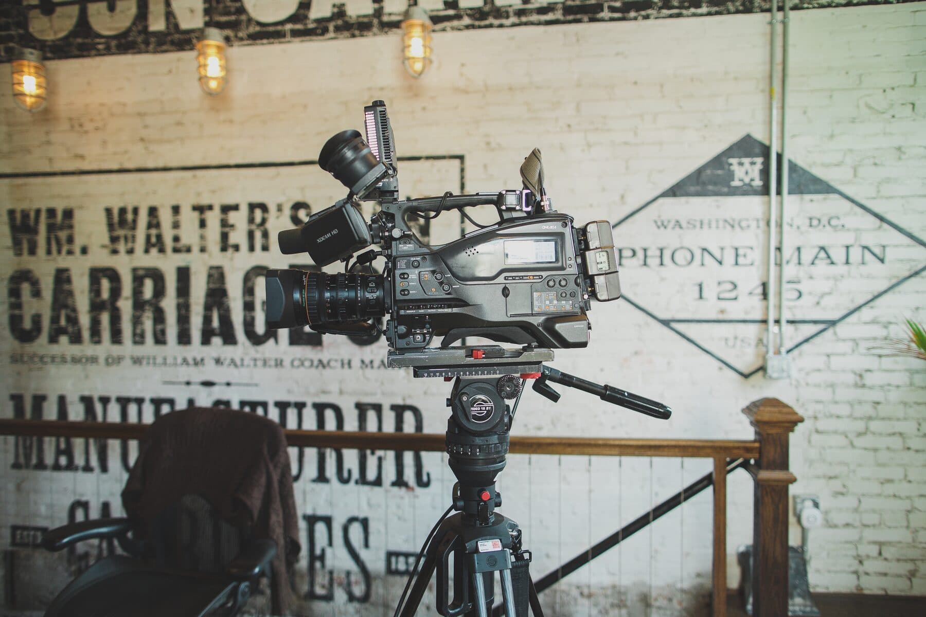 The Workhorse-painted ghost sign for Wm. Walter and Son Carriage Co. on the exposed brick wall of the DC studio.