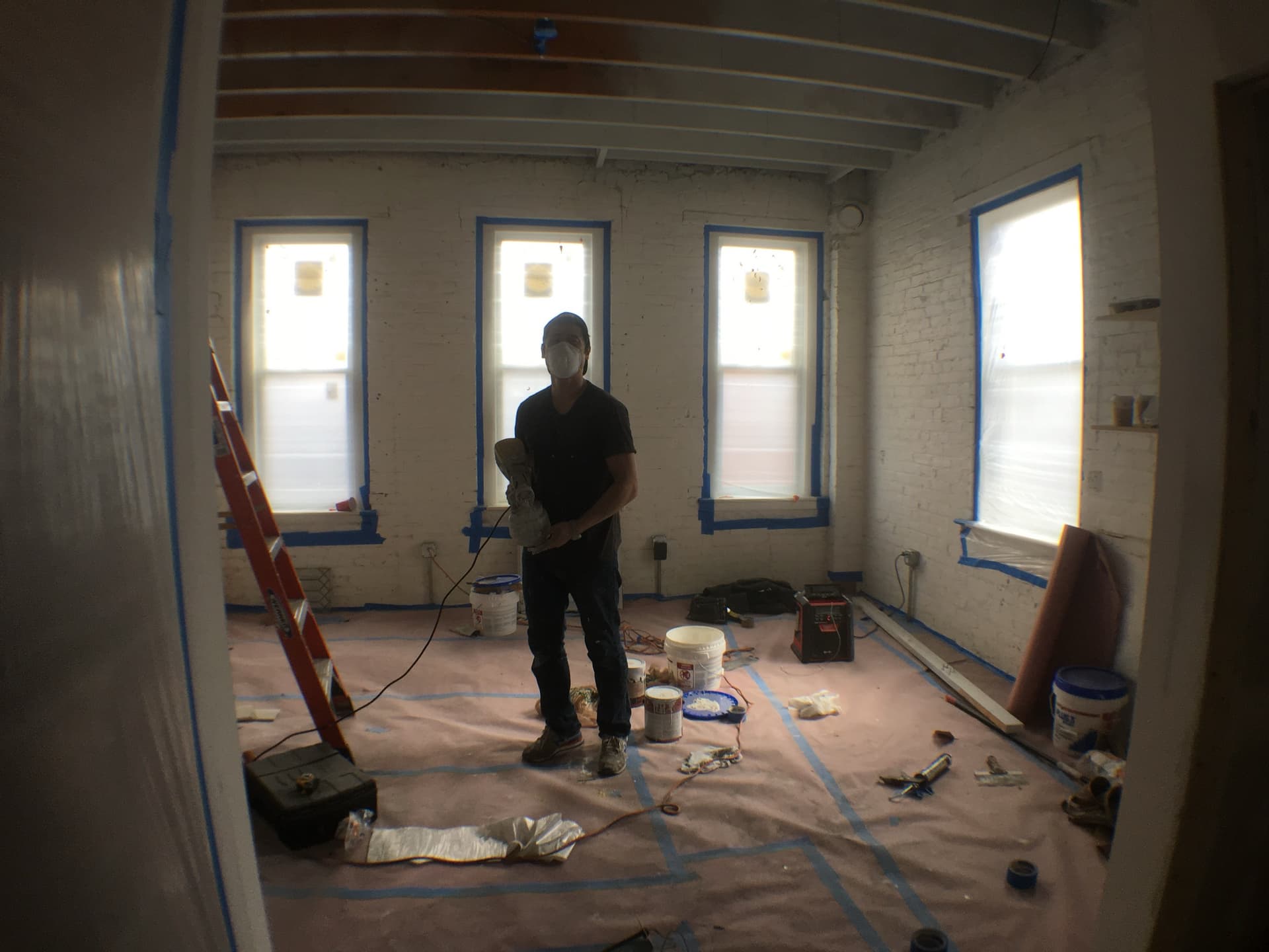 Joon painting the conference room walls before the first meeting in it.