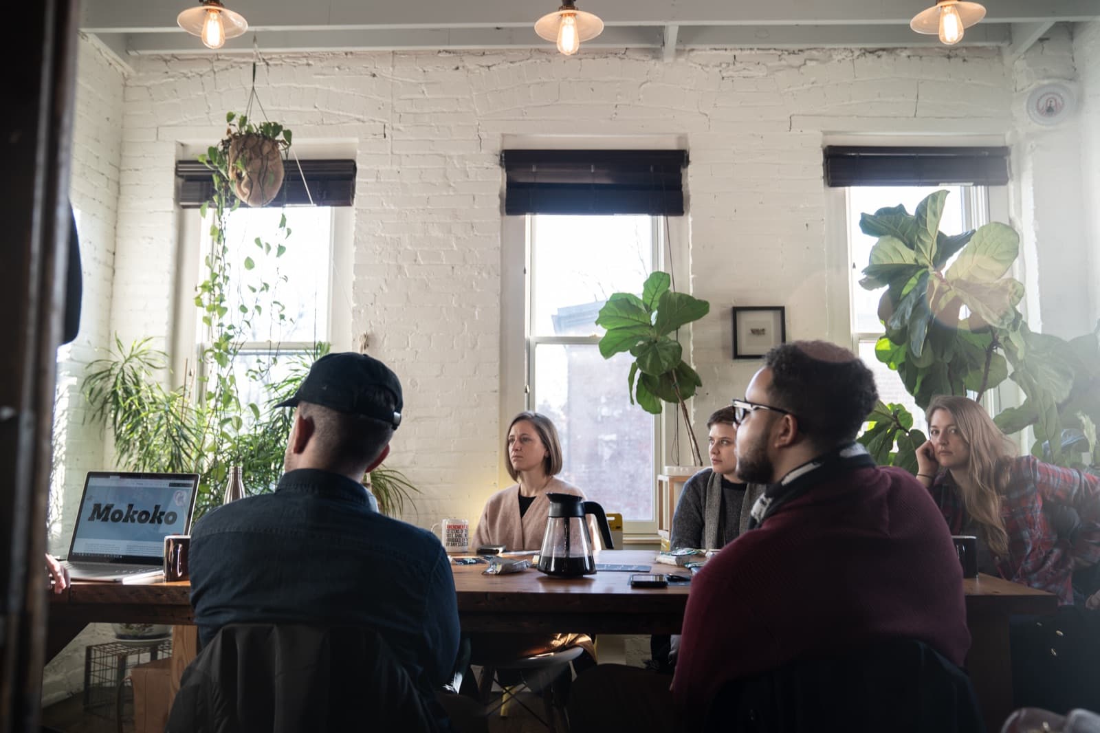 Audience seated around the studio worktable for the Dalton Maag State of Typography talk, fiddle leaf fig behind them.