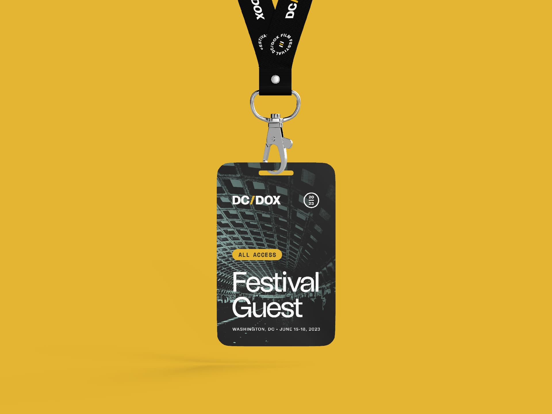 A DC/DOX festival guest badge on a lanyard