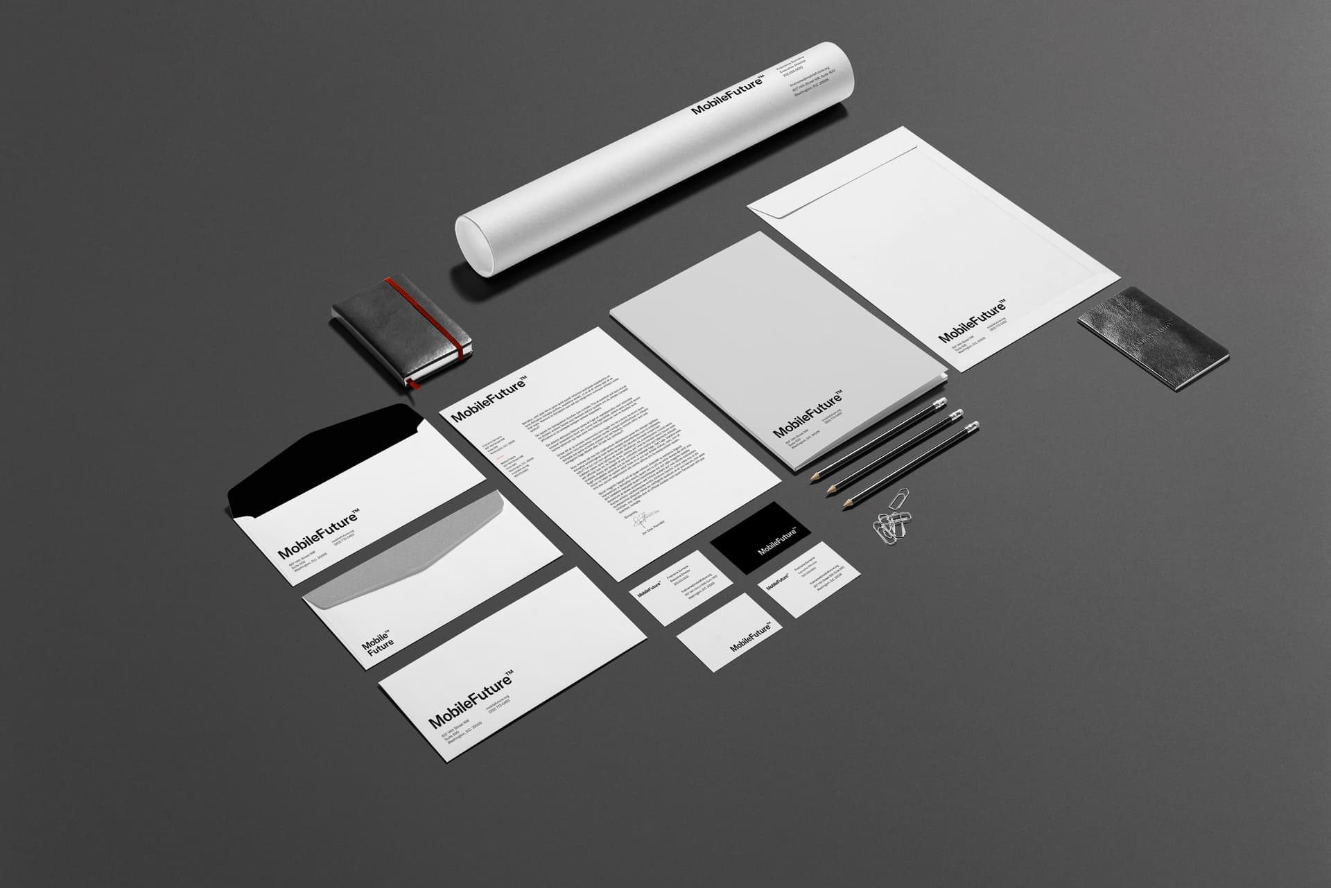 The Mobile Future stationery suite: letterhead, envelopes, cards and a mailing tube