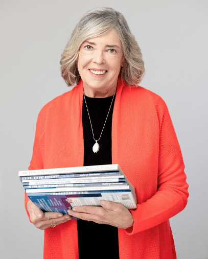 Kathryn Troutman holding a stack of the Resume Place guidebooks