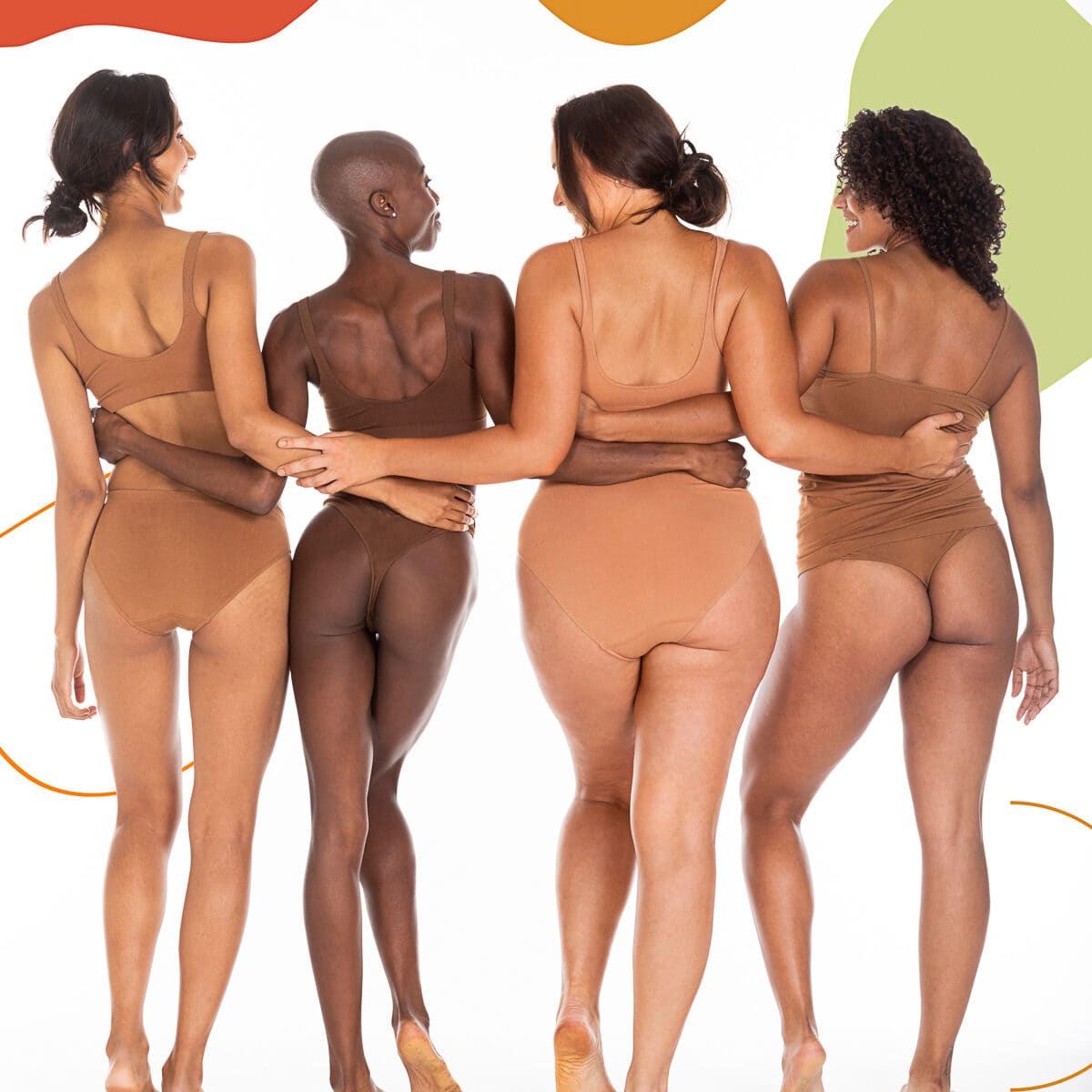 Four of the cast photographed from behind on white