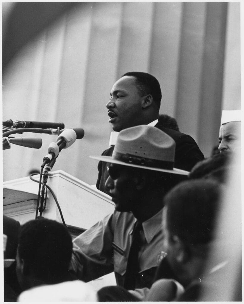 Dr. King speaking at a podium in Washington