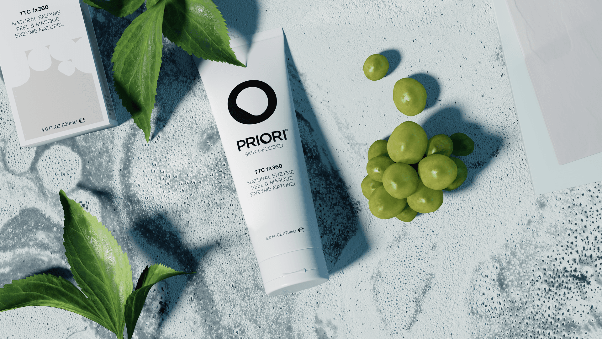 Natural Enzyme Peel and Masque with leaves and grapes on a pale marbled set
