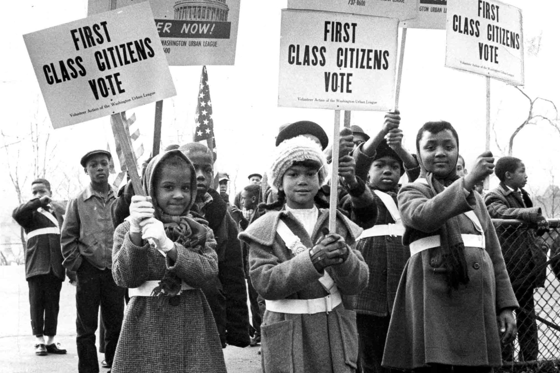 Children marching with First Class Citizens Vote placards, 1964