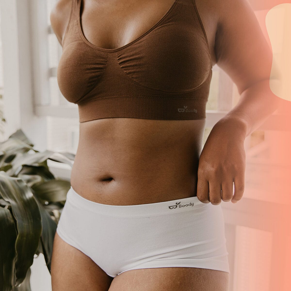 The nude range worn against the campaign coral and painted shapes