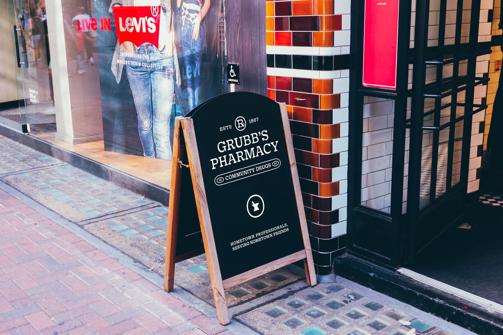 Grubb's Pharmacy sandwich board on the sidewalk