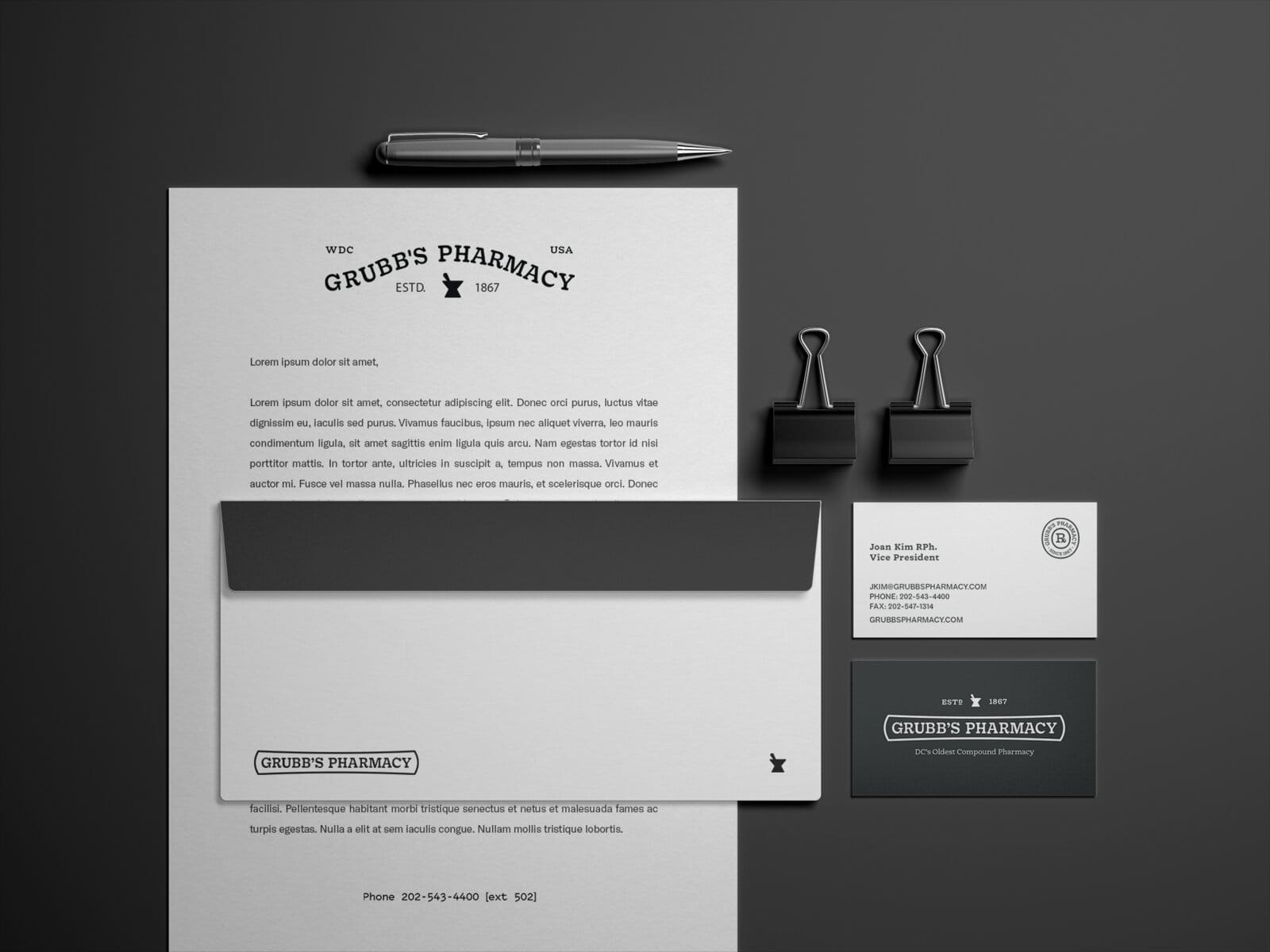 Letterhead and envelope set on dark ground