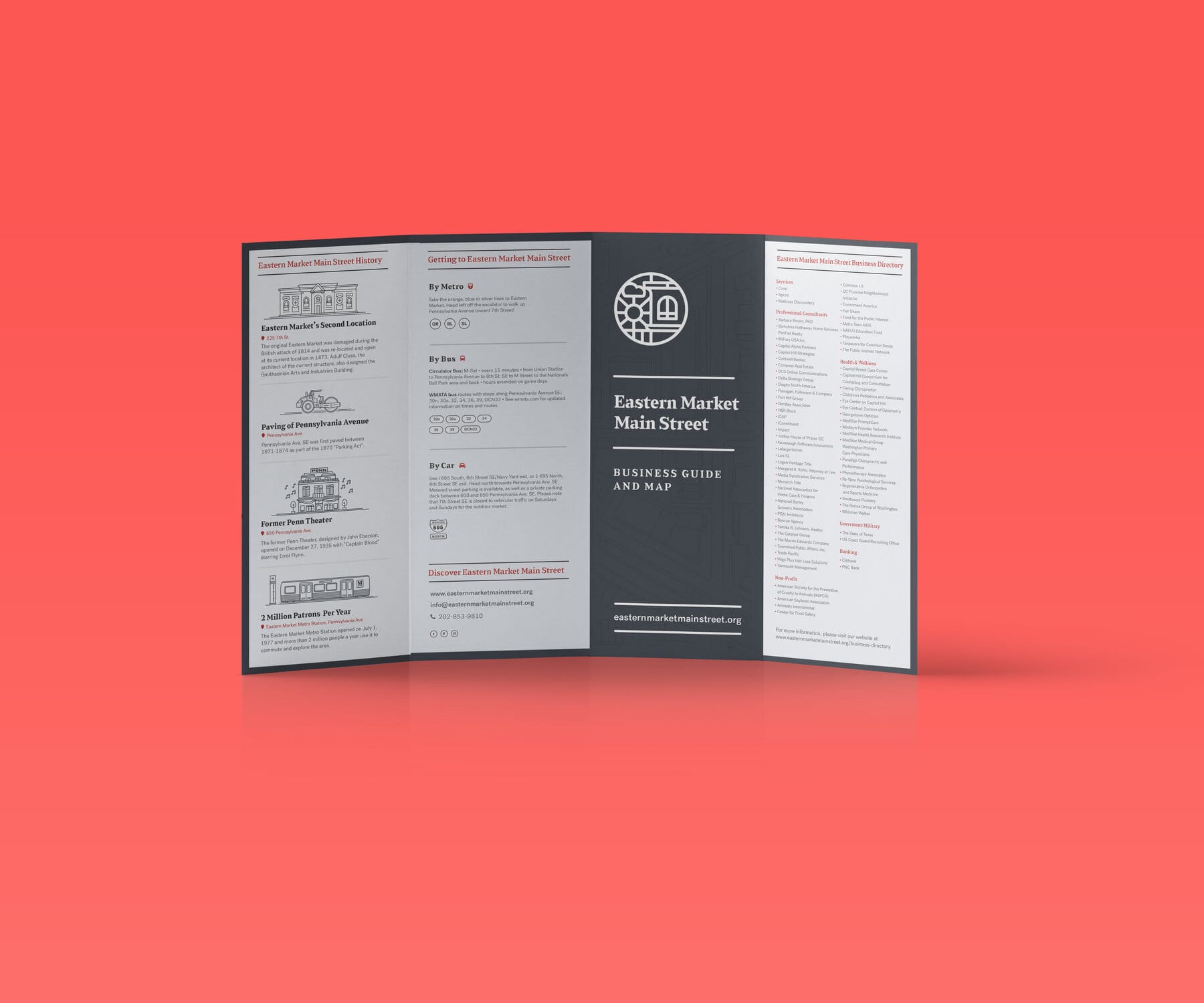 Tri-fold business guide open, charcoal panels with the medallion
