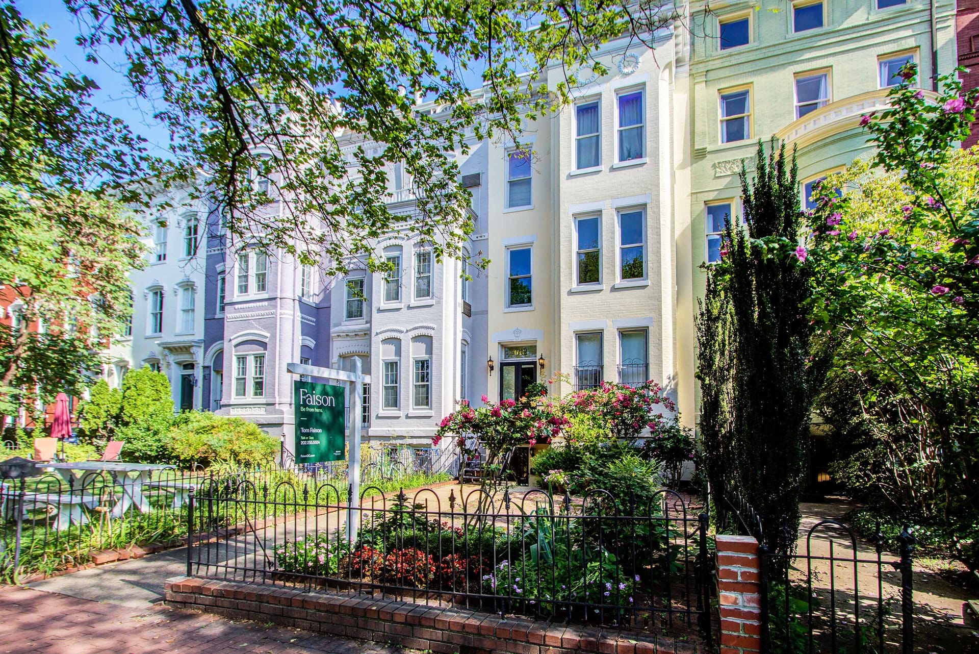 A row of Capitol Hill rowhouses with the Be From Here line